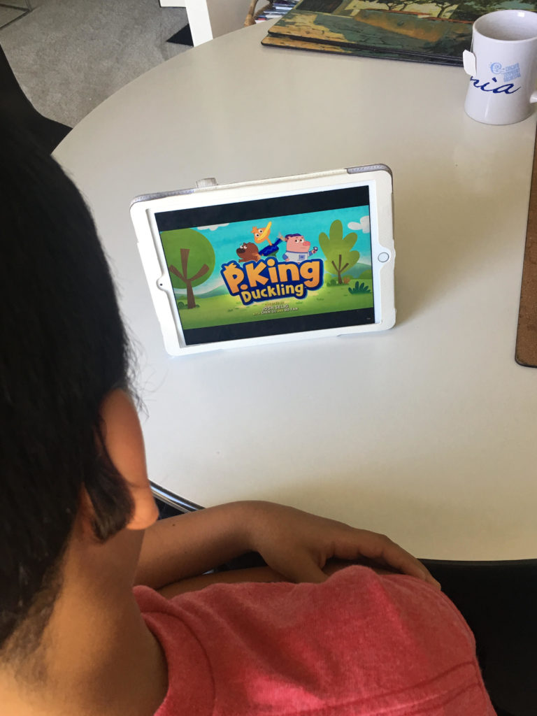 Watching P. King Duckling with Son