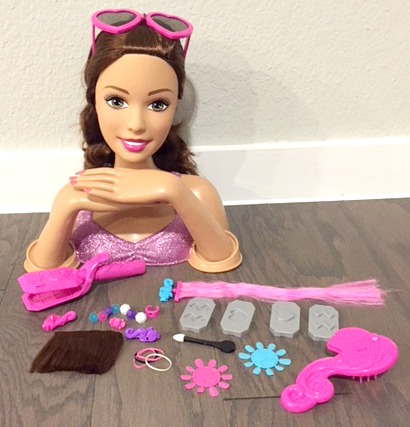 Play Hairsylist this Christmas with Barbie Crimp and Color Deluxe Styling Head Doll